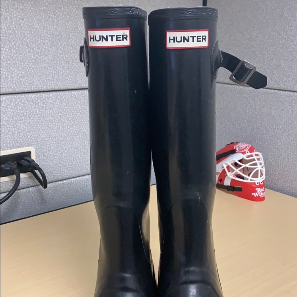 Tall black hunter boots